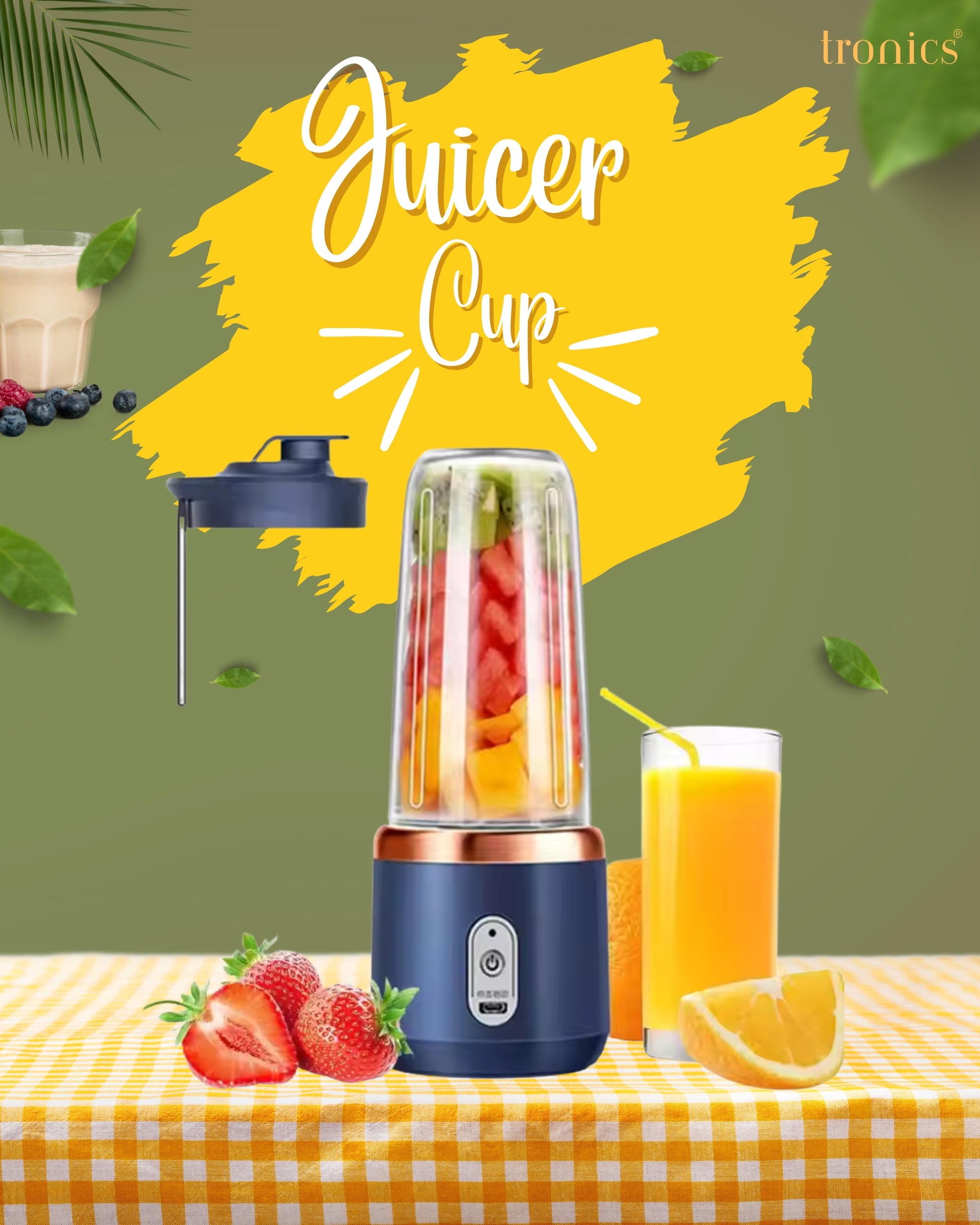 Portable personal juicer cup on office desk with fruits
